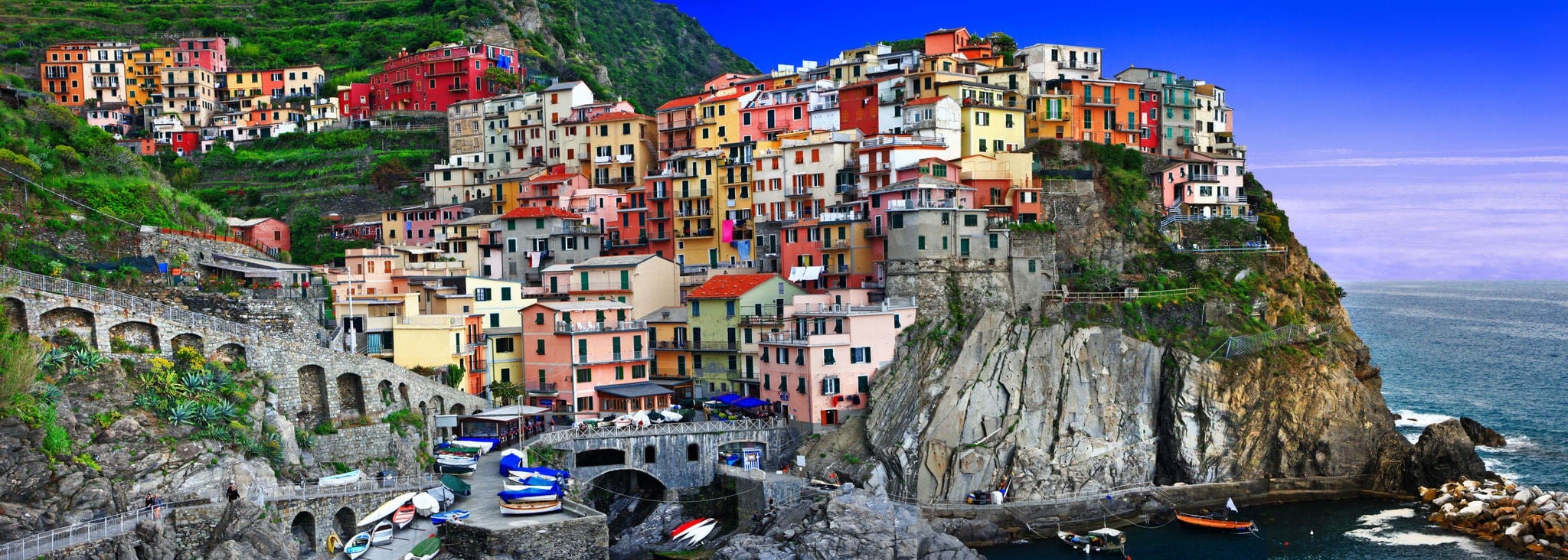 Italian scenery.Colorful houses on the rock - famous Manarola fishing village National park Cinque terre in Liguria, Italy