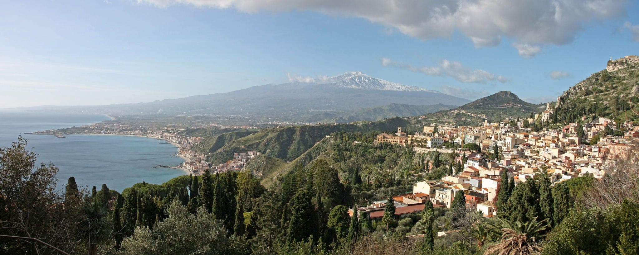 Italy, Sicily. View of Taormina and Mount Etna from the walls of the Greek Theater