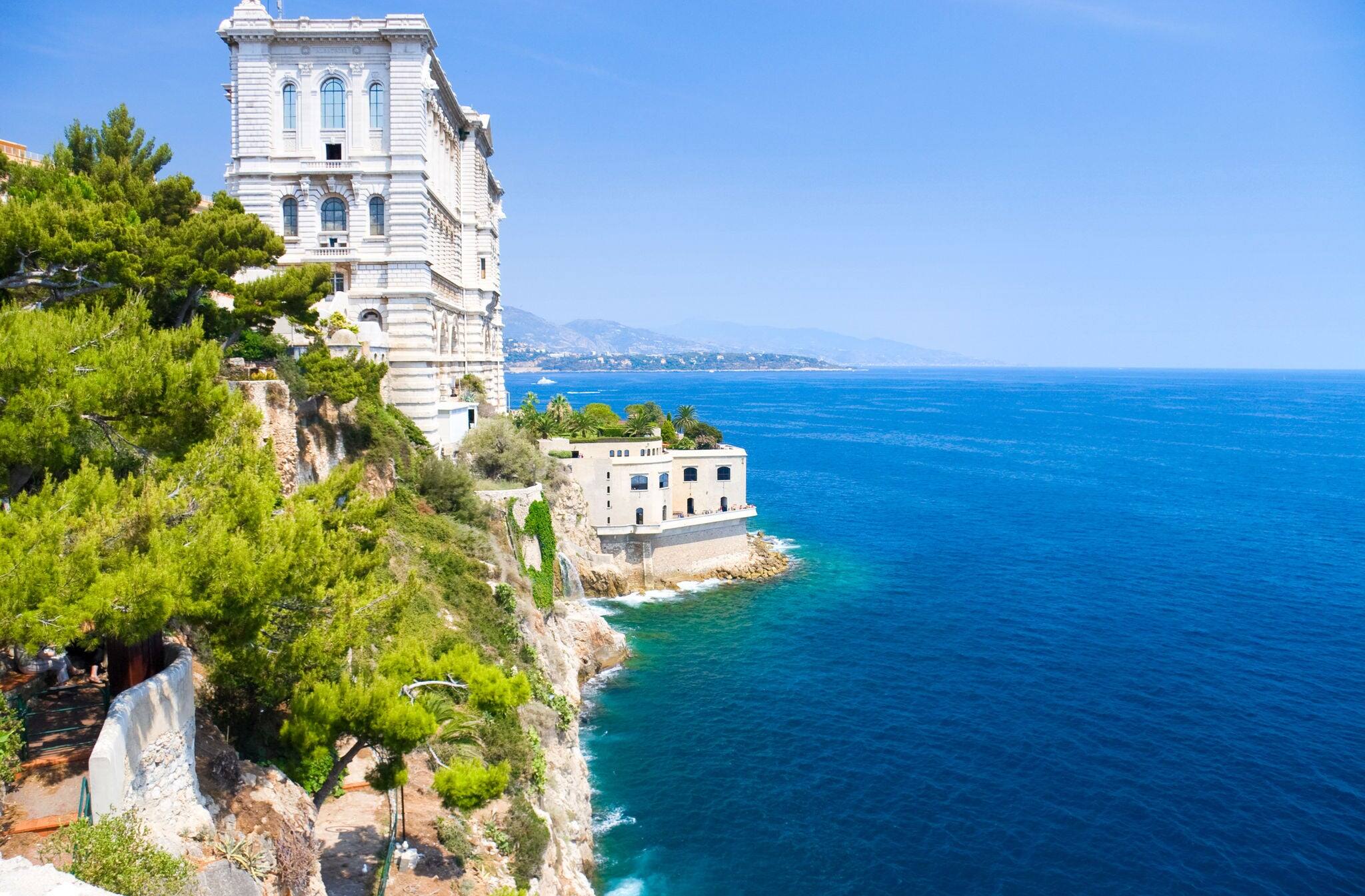 Monaco coast. Ancient buildings and blue sea.