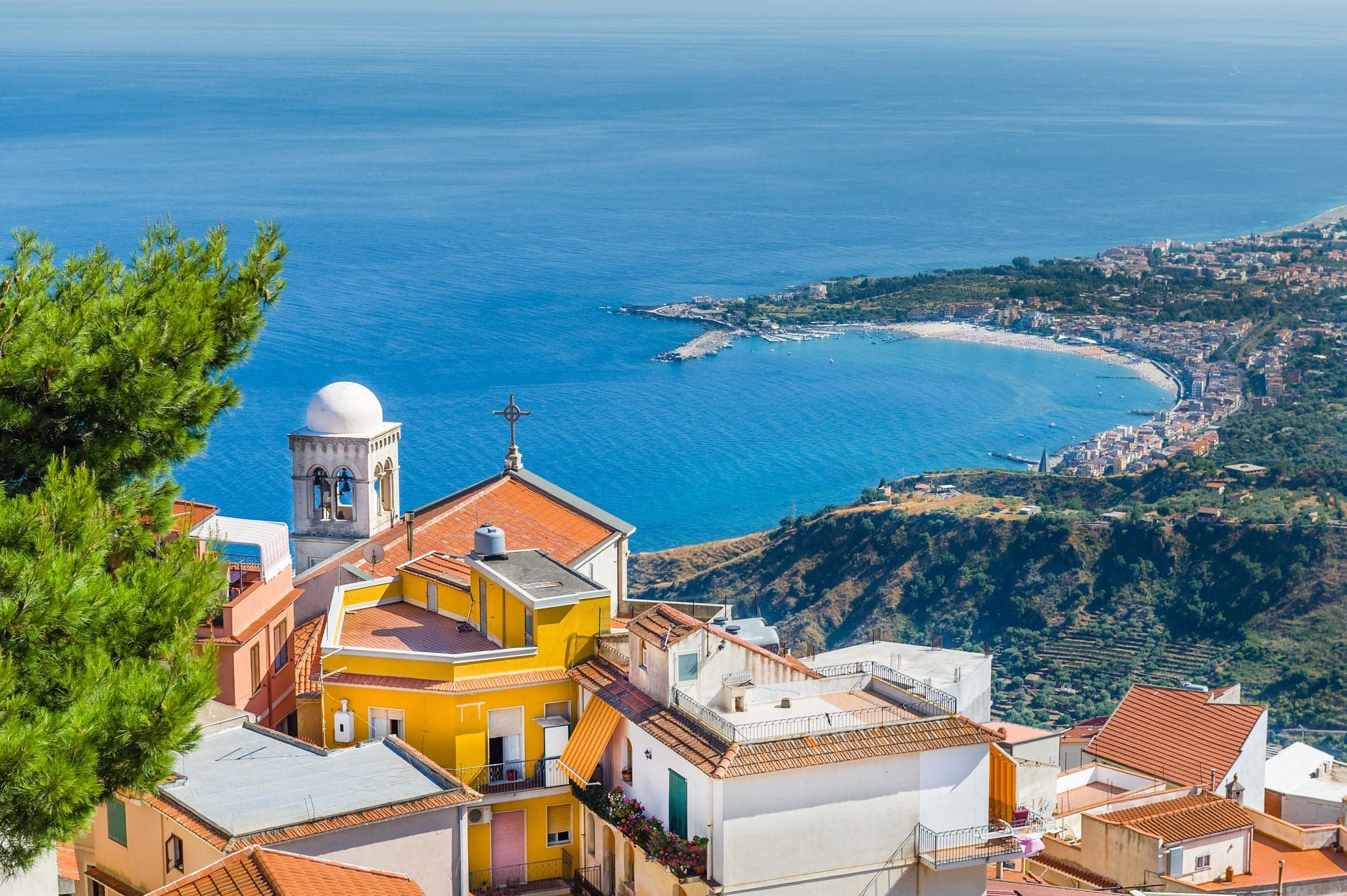 View from mountain to Taormina town and Mediterranean ocean. Sicily, Italy.