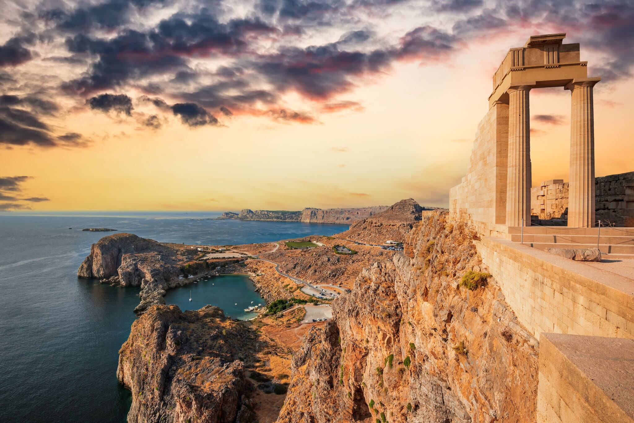 Rhodes, Greece. Lindos small whitewashed village and the Acropolis, scenery of Rhodos Island at Aegean Sea.