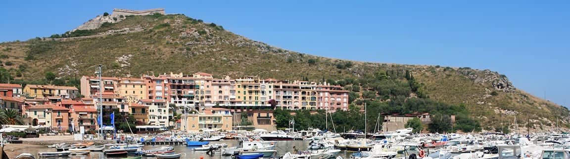 View of the small marina of Porto Ercole, Tuscany, Italy.