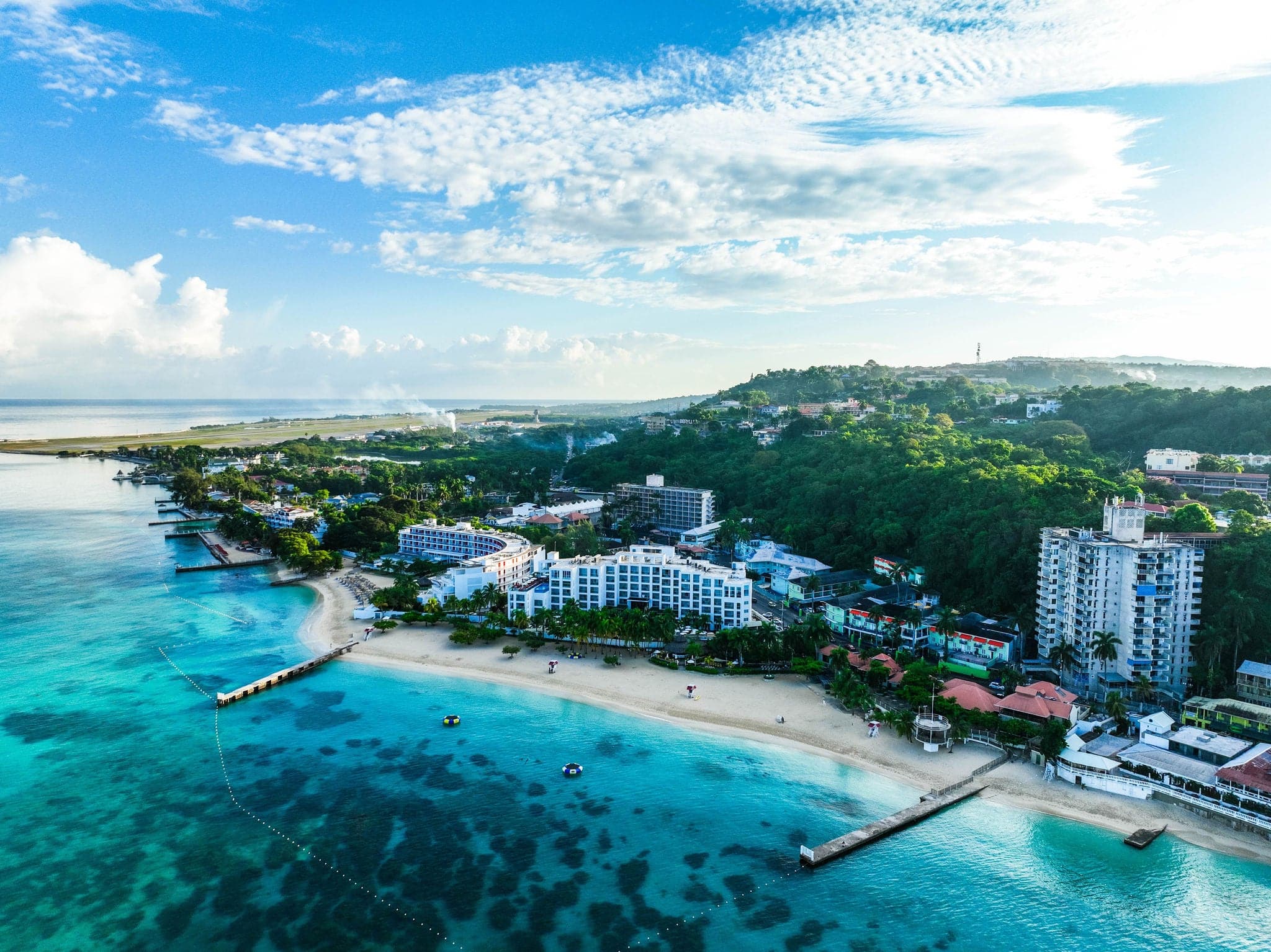 Aerial view of Montego Bay waterfront with hotel and beaches.