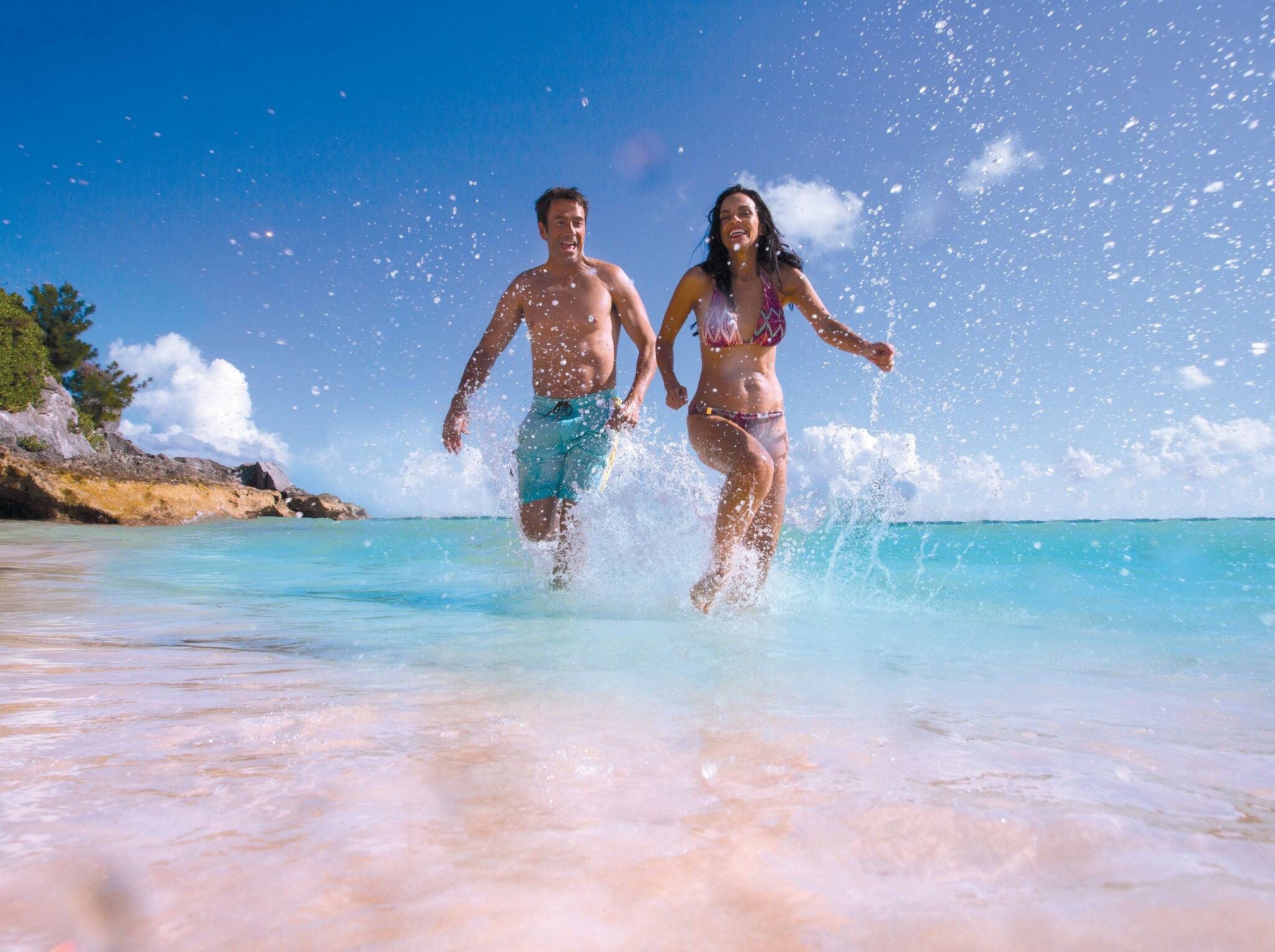 NCL-Lifestyle-Cruise-Couple-Running-Splashing