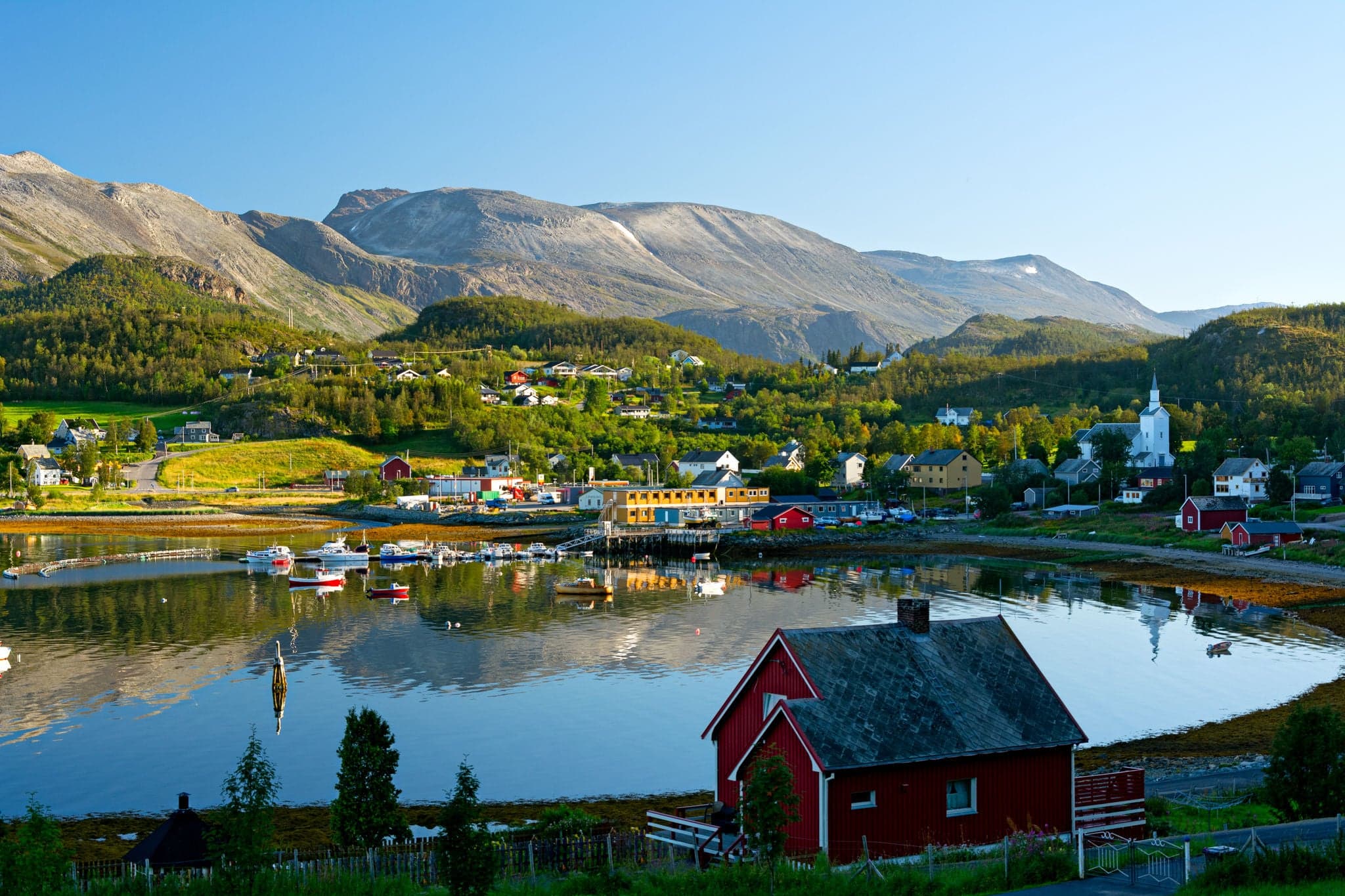 Characteristic small norwegian town near a fiord. Near Alta, Norway.