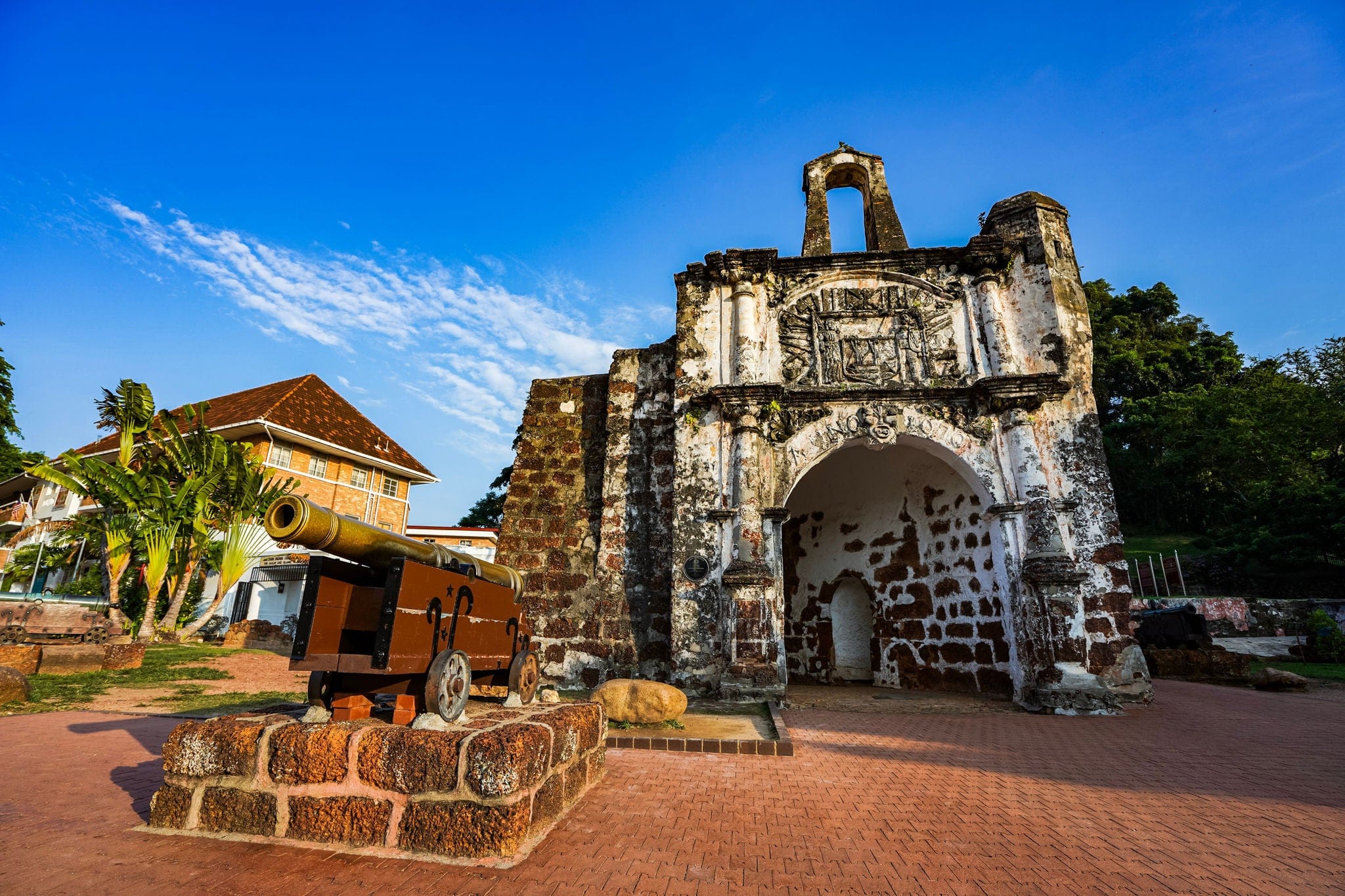 Melaka, Malaysia - June 2019. an old cannon replica in Porta de Santiago, a small gate house, is the only part of the A Famosa fortress which still remains today.