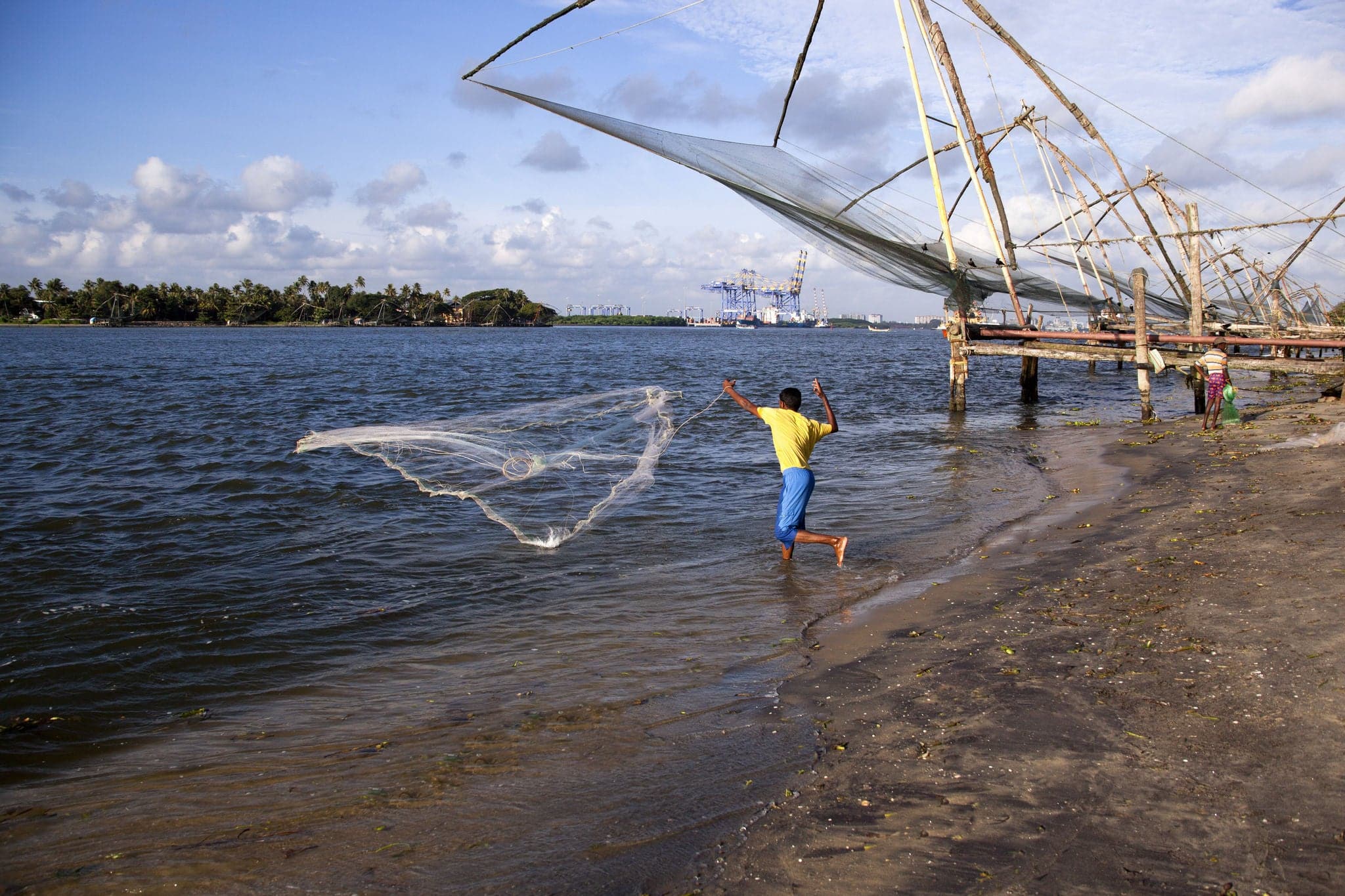 Fisherman fishing in the sea, Cochin, Kerala, India