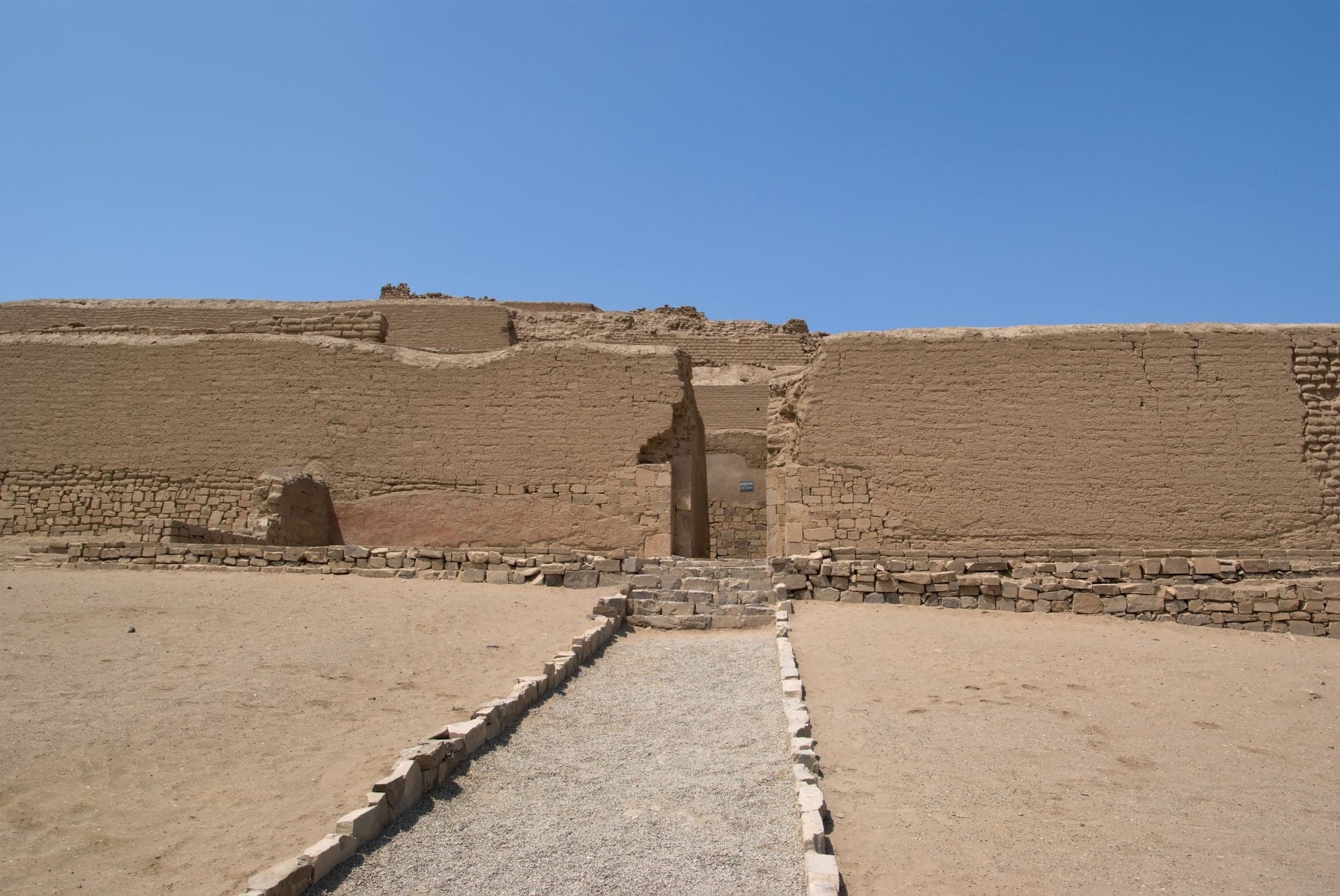 The spectacular Incan Temple of the Sun in Pachacamac, located at the top of a rocky promontory, overlooking the Pacific ocean, is made of four pyramid bodies truncated to superimpose one another.