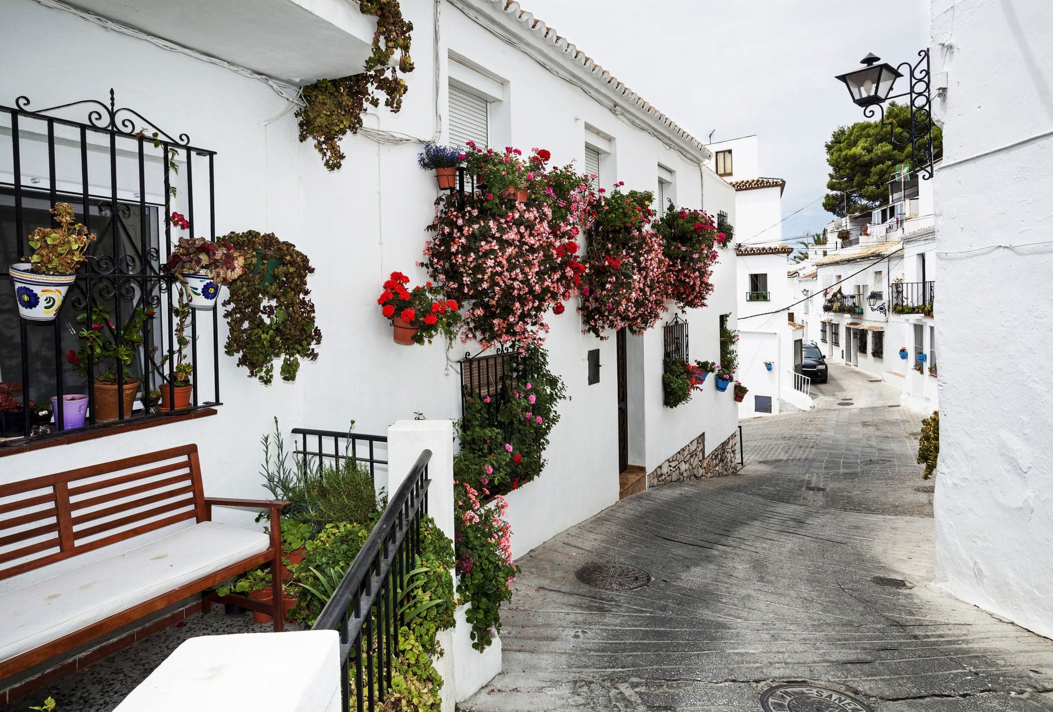 Street with flowers in the Mijas town, Spain