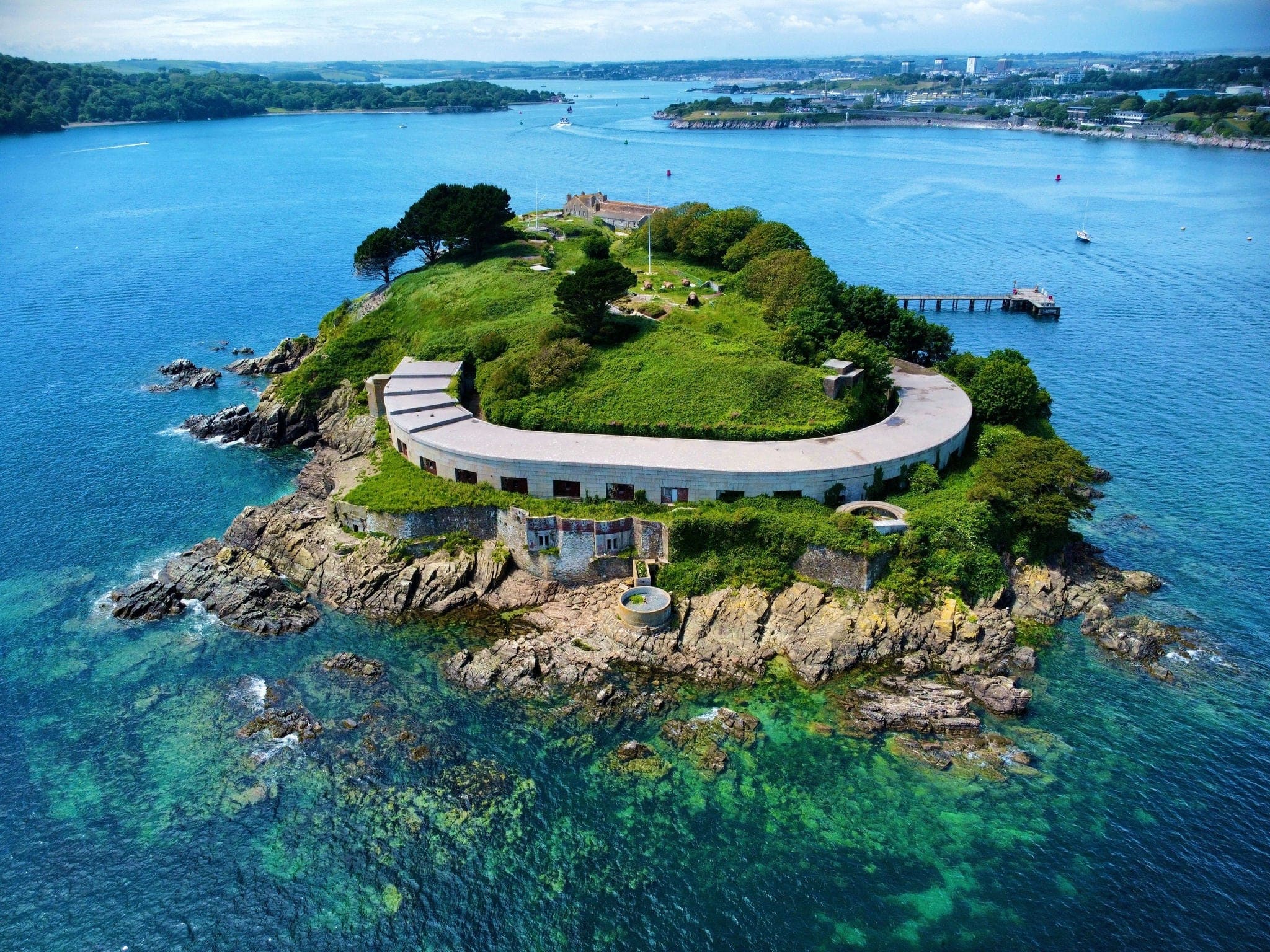an Aerial view of Plymouth England's Drake's Island featuring coastline and harbor