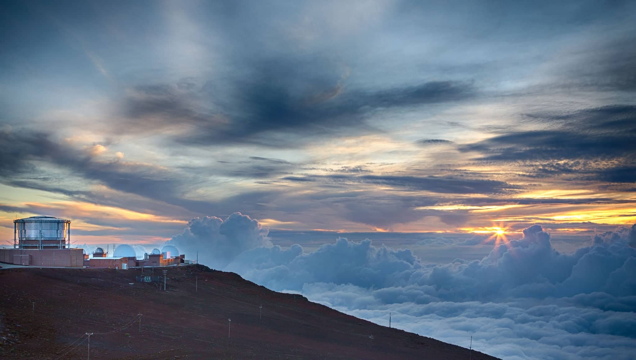 Haleakala Observatory on the summit of the volcano on Maui during sunset.