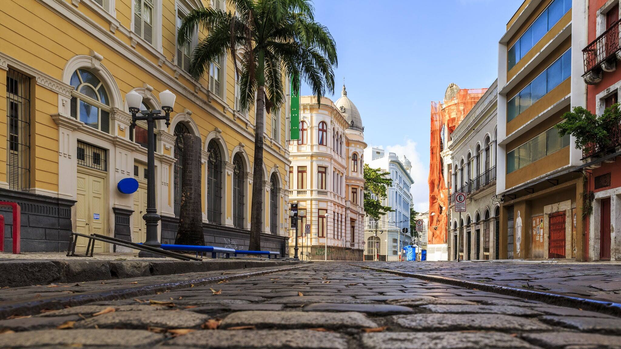 View of the historic Rua do Bom Jesus street in the city of Recife in Pernambuco, Brazil on a sunny summer day with its cobblestones and 17th century buildings.