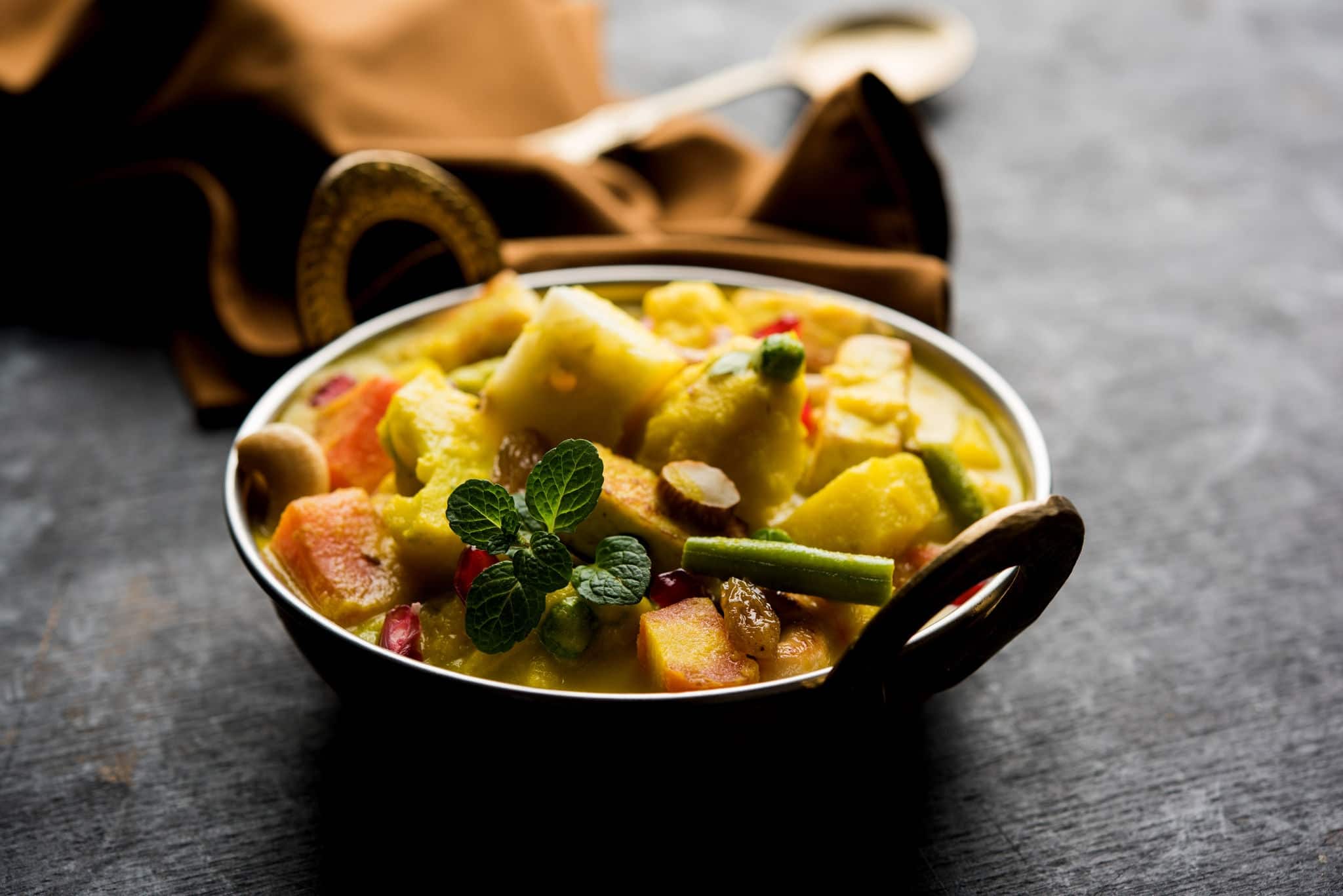 Navratan Korma is a rich, creamy and flavorful Mughlai dish  from India that literally translates to nine-gem curry. The “gems” are the fruits, vegetables and nuts that make up the curry.