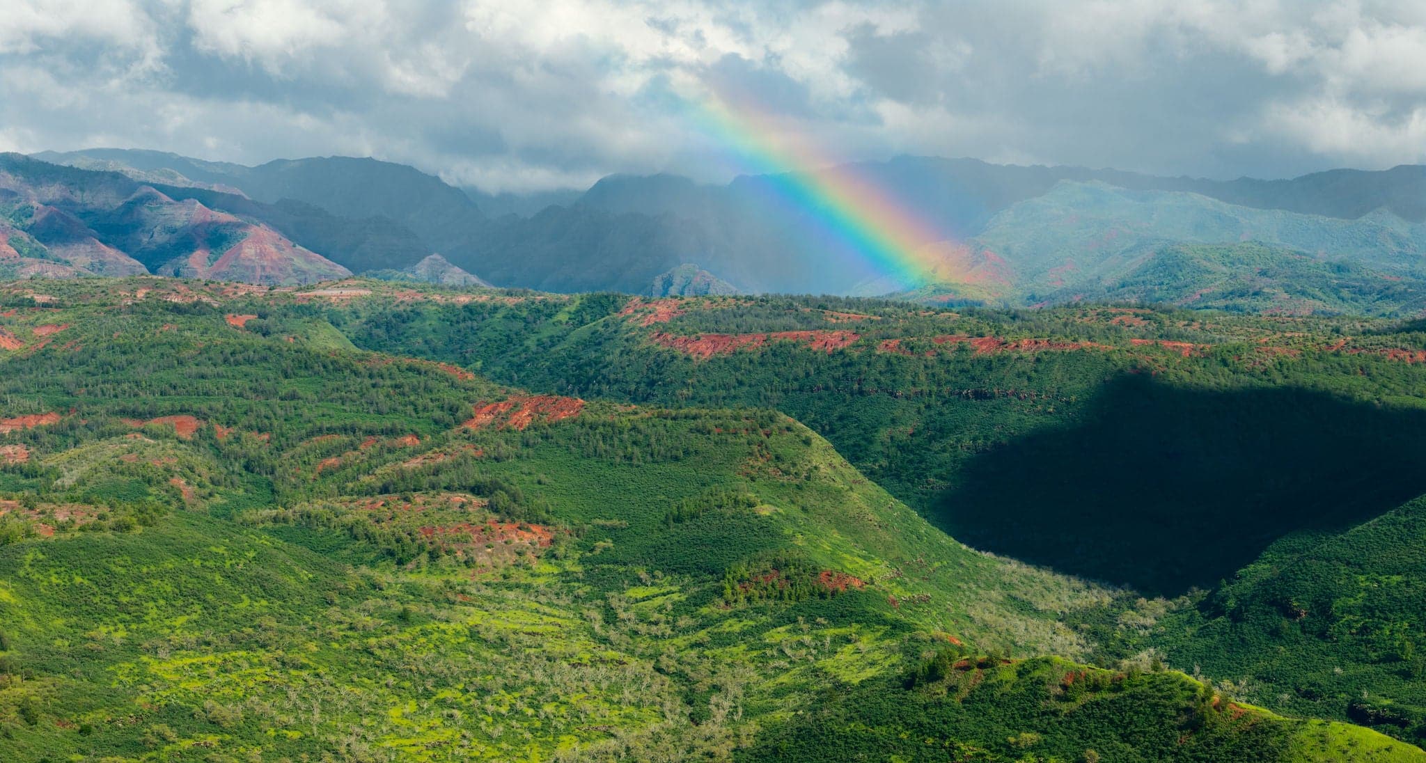 rainbow over waimea canyon area