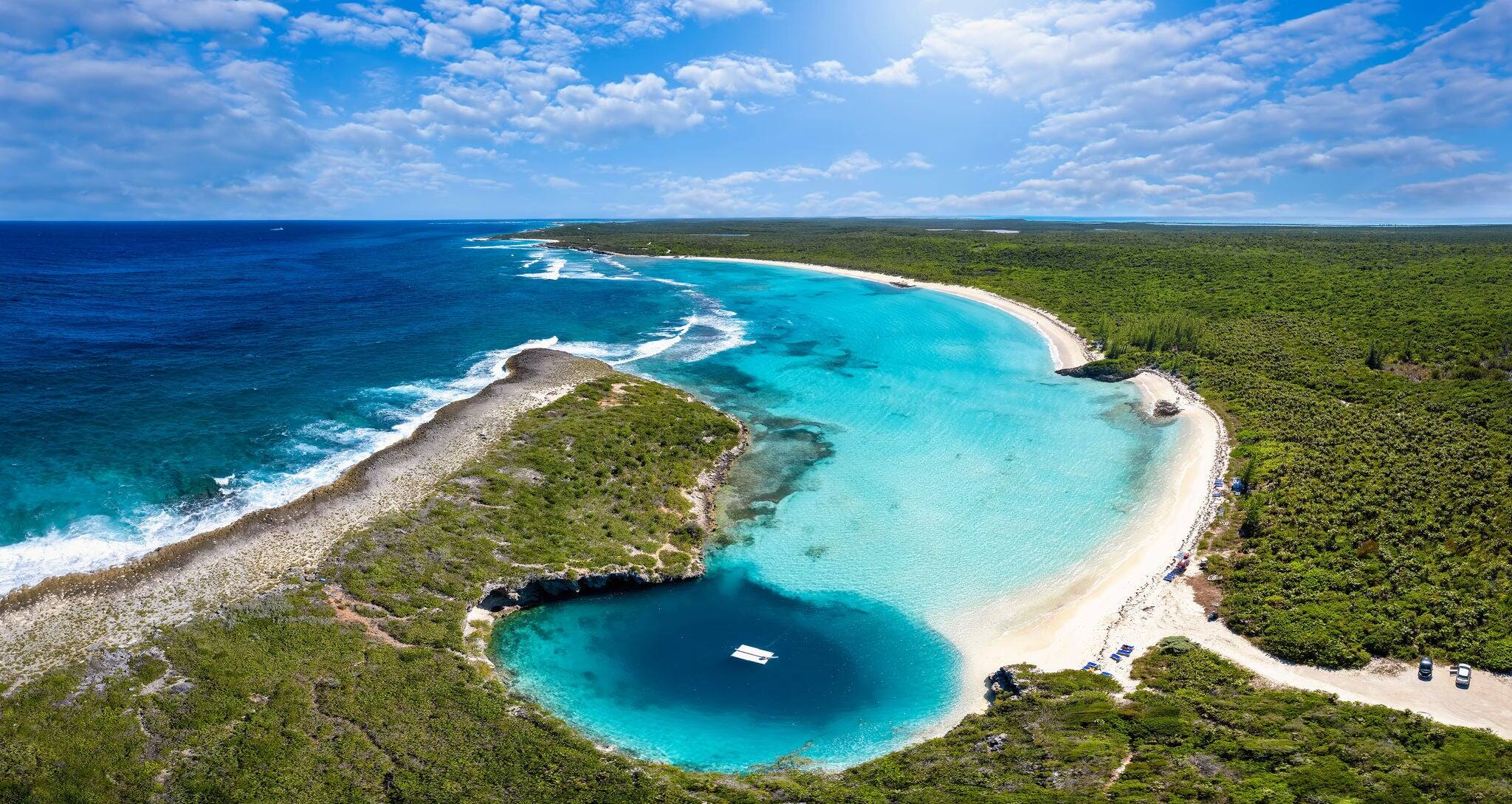 Panoramic aerial view to Dean's blue hole with the connecting lagoon and beautiful beach with turquoise sea, Long Island, Bahamas