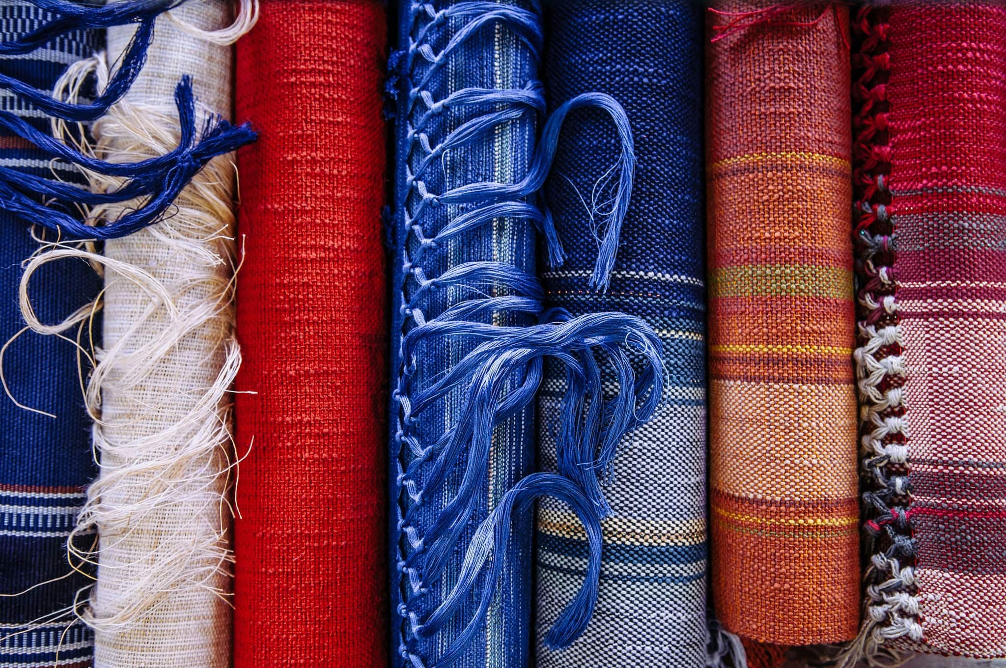 Handmade Okinawa traditional silk or cotton fabric textiles, blue colour with lines pattern, close up texture details