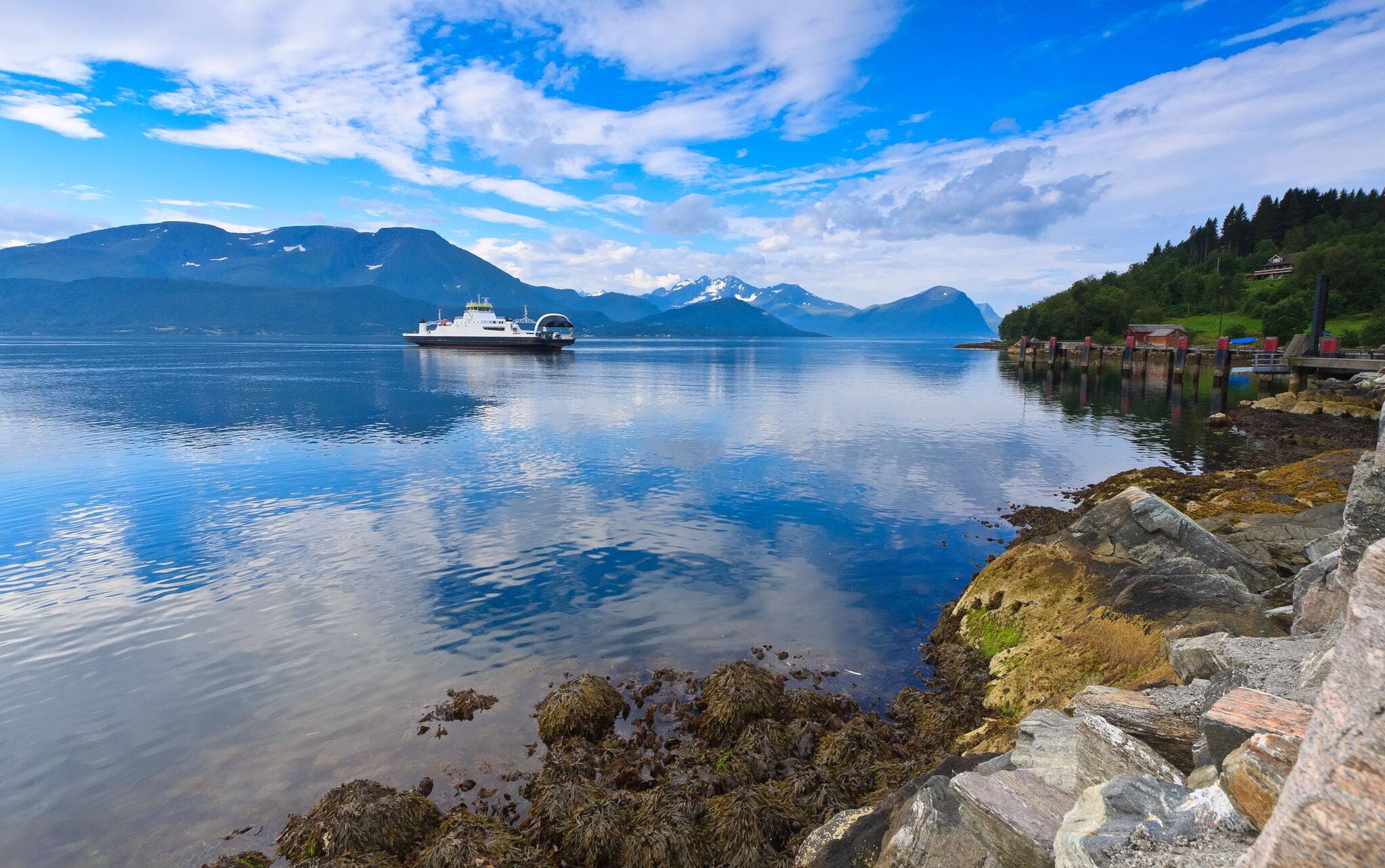 Ferry landing MagerHolm near Alesund in the Storfjord fjord on the summer morning, Norway