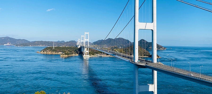 Shimanami Kaido bridge connects Japanese islands for island hopping.