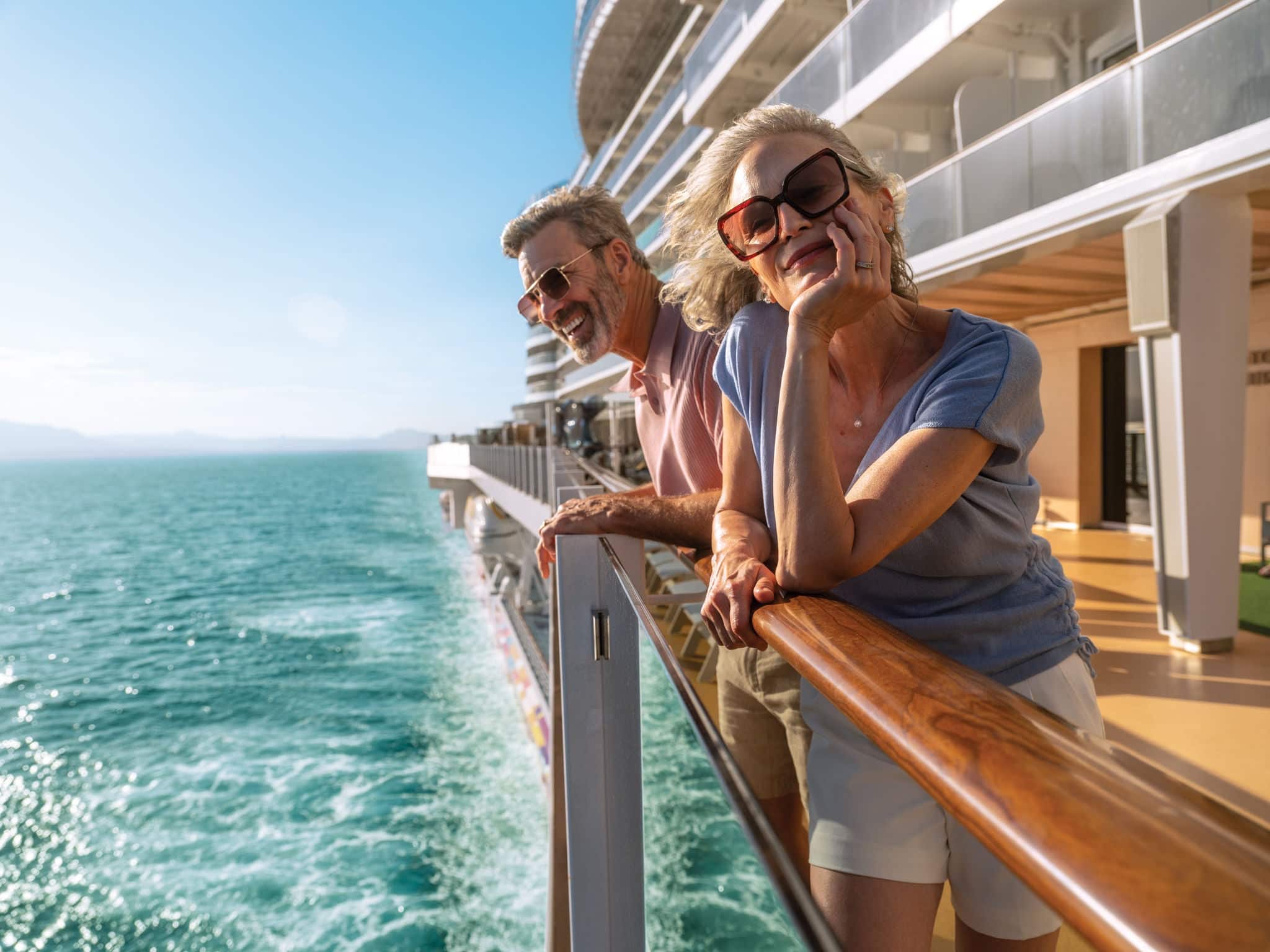 Couple looking over railing.