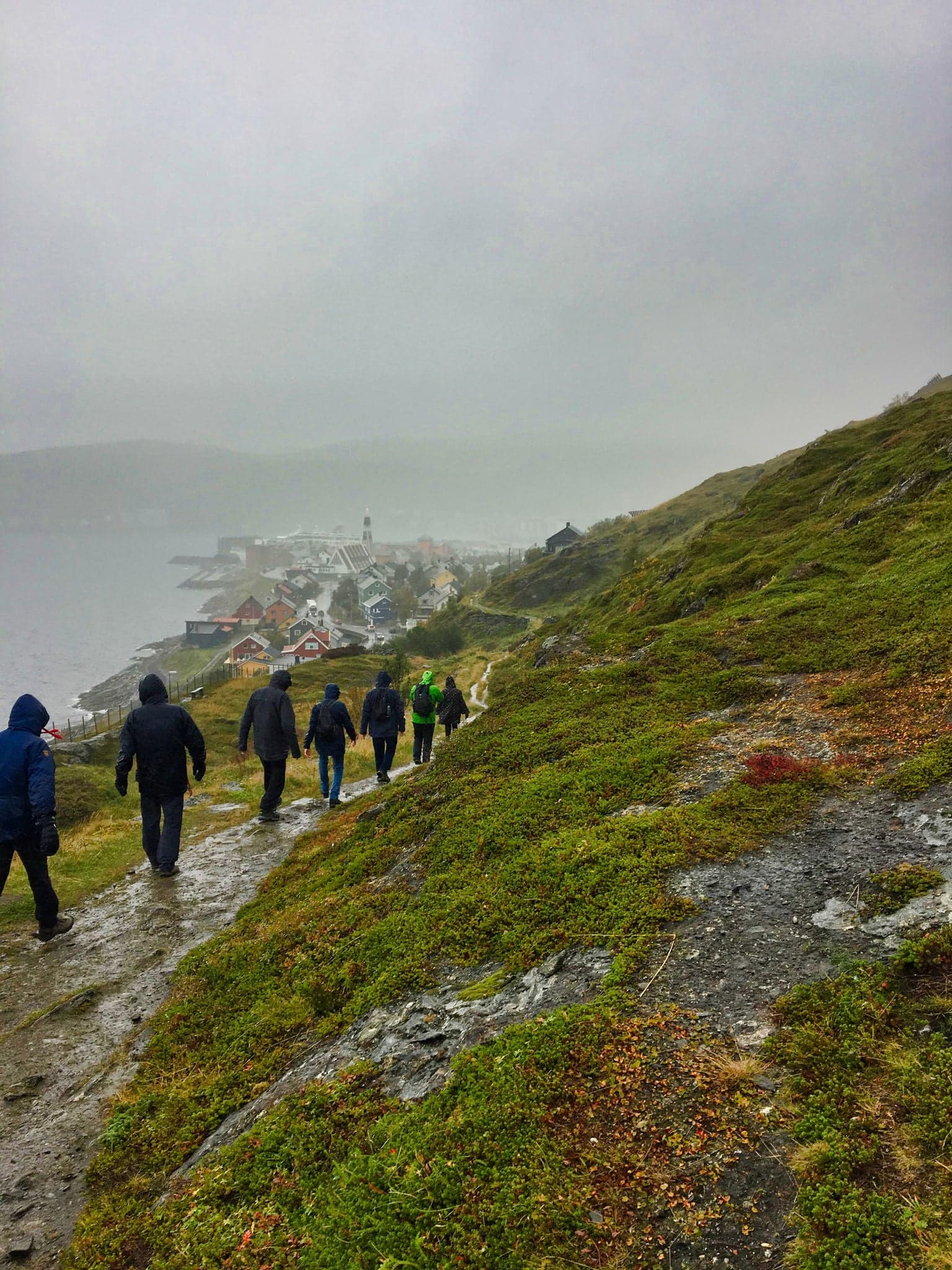 walking in the rain on a mountain in hammerfest norway