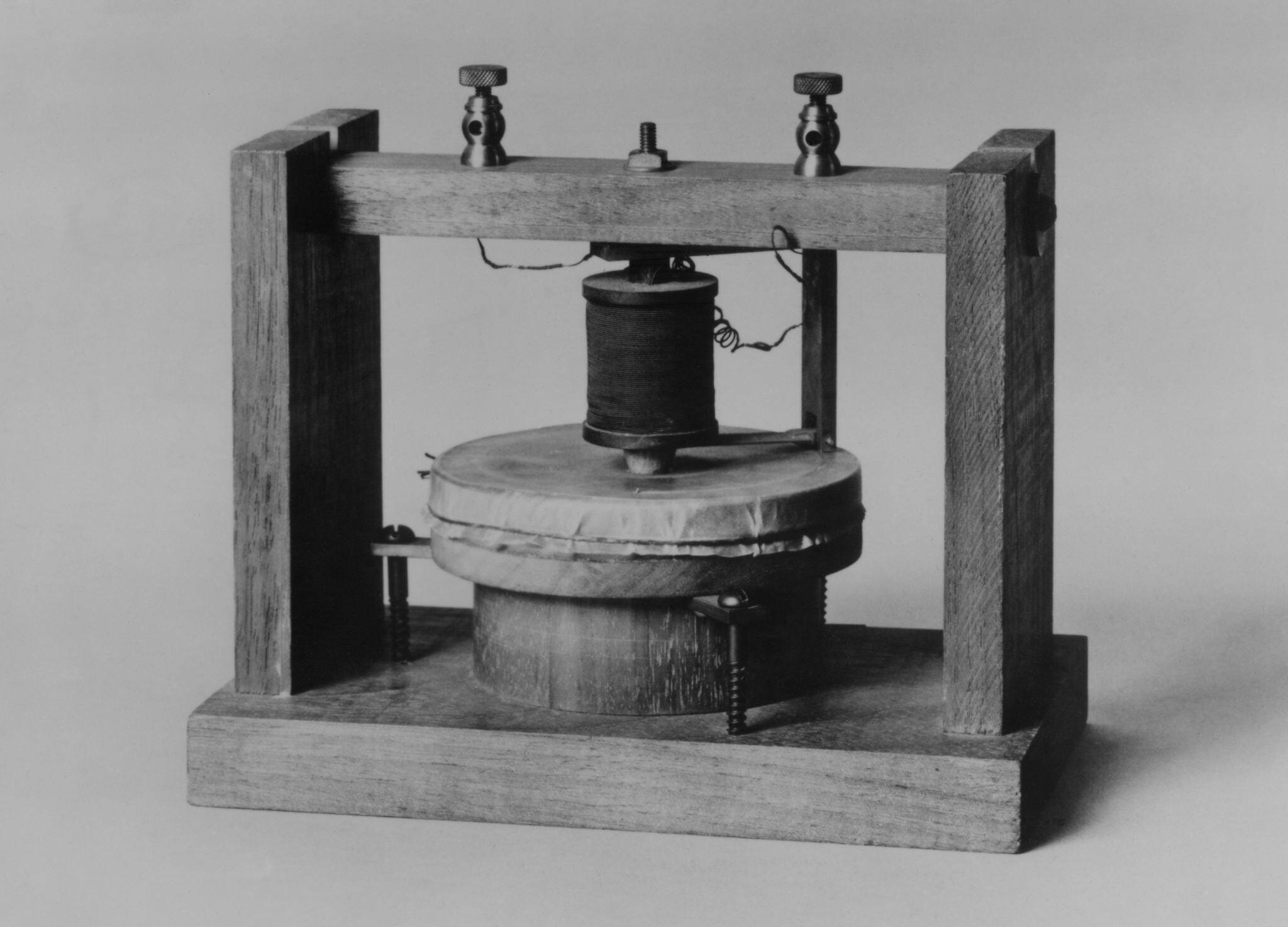 Voice sounds were transmitted for the first time on June 3, 1875 over this instrument invented by Alexander Graham Bell and Thomas Watson. The diaphragm was made of tightly stretched animal membrane.